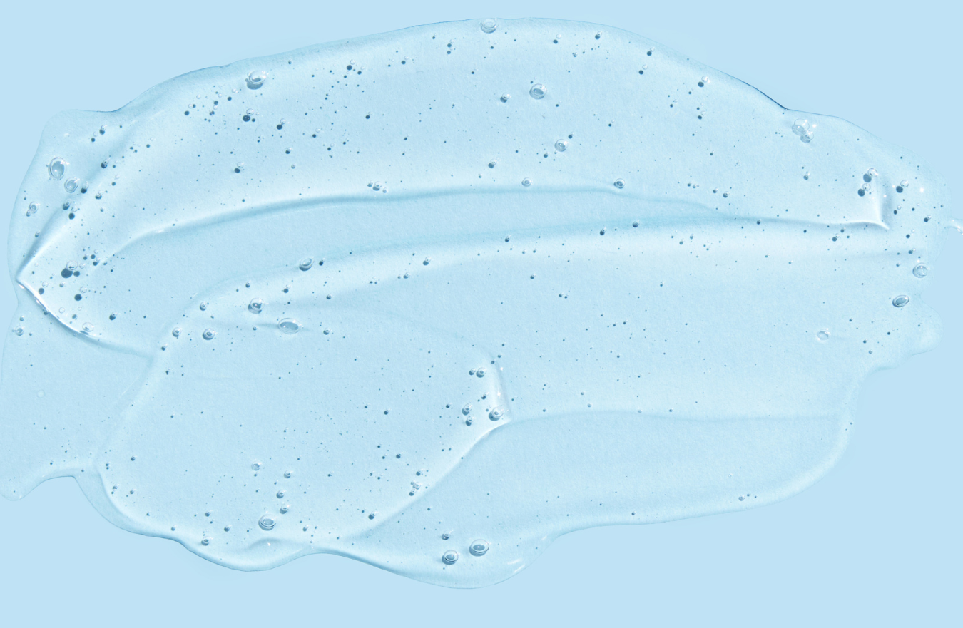 Blue gel or cream texture on a light blue background